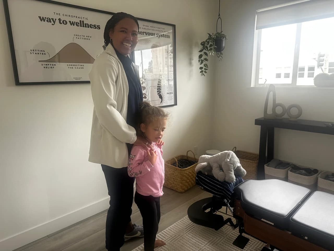 Dr. Danika with a young patient in the Fika office