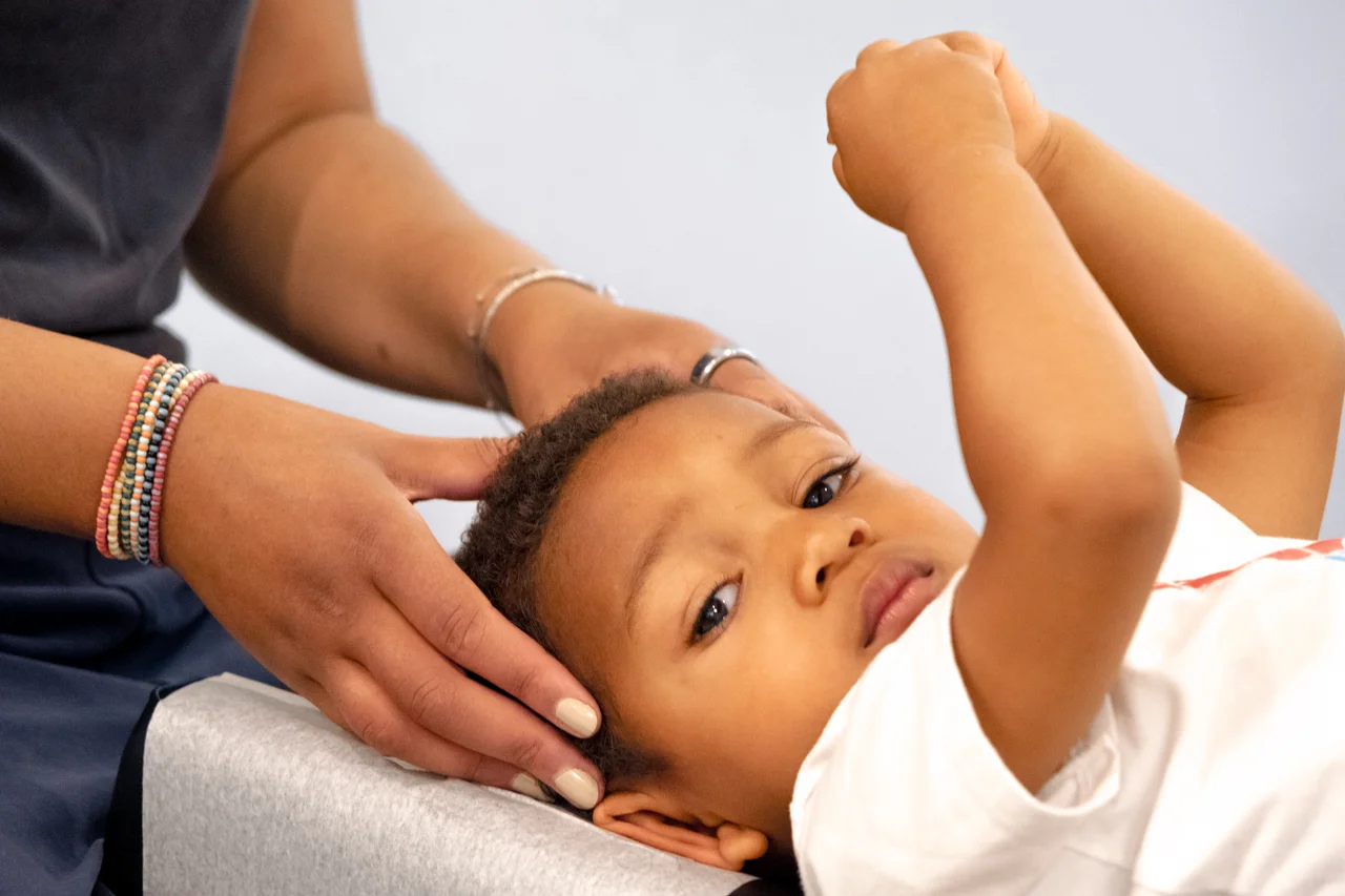 Child receiving chiropractic adjustment